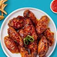 K' Town Wings · Fresh chicken wings breaded, fried until golden brown, and tossed in soy sauce, brown sugar,...