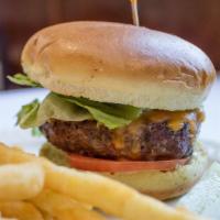 Classic Cheeseburger · Char-grilled ground beef patty topped with lettuce, tomato and yellow American cheese. Serve...