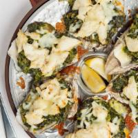 Oysters Rockefeller · A 1/2 dozen Chesapeake oysters baked with jumbo lump crab, chopped spinach, bacon, Parmesan ...