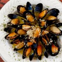Garlic Butter Mussels · Farm raised mussels in garlic butter and parsley.