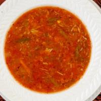 Bowl Maryland Crab Soup · Claw meat and vegetables in a tomato base