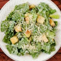 Caesar Salad · Crisp romaine, grated Parmesan cheese and baked croutons tossed in a homemade creamy Caesar ...