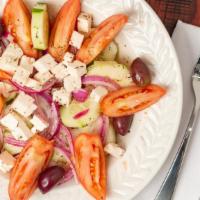 Horiatiki Salad · Grape tomatoes, cucumber, red onion, imported Greek Kalamata olives, feta cheese and Greek o...
