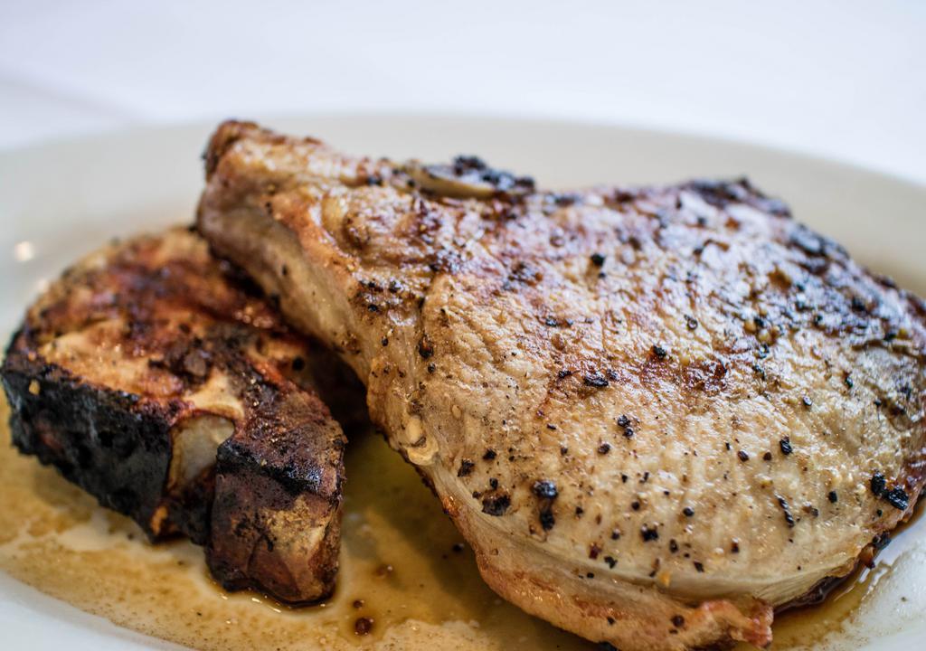 Jumbo Pork Chops · 2 char-grilled, hand cut and juicy pork chops. Served with your choice of 2 side items.