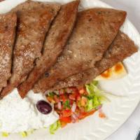 Gyro Platter · Popular item. Tender gyro meat served over pita wedges topped with lettuce, tomato, onion, p...