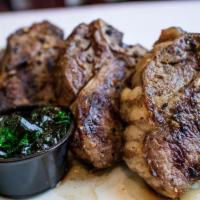 Lamb Chops · Succulent t-bone chops of young lamb loin cooked with traditional Greek herbs and spices. Se...