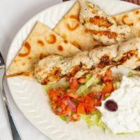 Chicken Souvlaki Platter · Char grilled breast of chicken served over shredded lettuce with tomato, onion, parsley, tza...