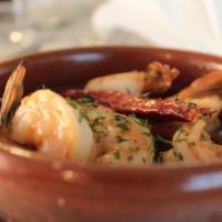 Gambas Al Ajillo · Gluten free. Sautéed shrimp in extra virgin olive oil, fresh roasted garlic, and brandy.