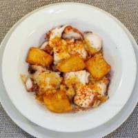 Pulpo A La Gallega · Hot octopus with potatoes, paprika, and roasted garlic.