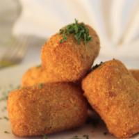 Croquetas · Guardado's favorite: Bechamel fritters with chicken and Serrano ham.
