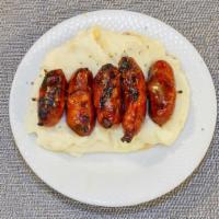 Pinchitos · Little spicy. Grilled Spanish pork sausage with mashed potatoes.