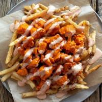 Native Buffalo Fries · Our signature seasoned fries are topped with crispy strippers, chopped and tossed in medium ...