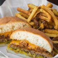 Western Burger · Our Shiner Bock skillet chili, cheddar cheese, mustard and pickle