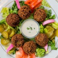 Falafel Plate · All vegetable patties made of fava beans, chickpeas, onions, parsley, cilantro, special spic...