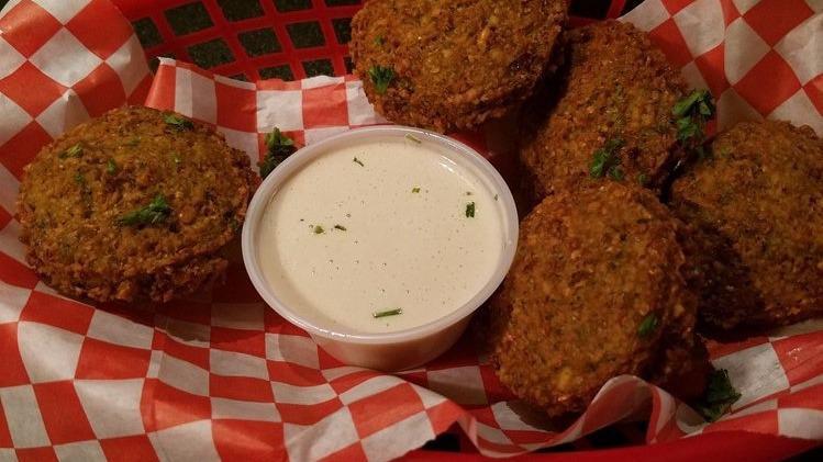 Falafel Basket (5 Patties) · Delicious patties of ground cooked garbanzo beans mixed with our special blend of spices the fried to perfection. Served with tahini sauce and fresh baked pita bread.