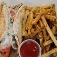 Gyro Sandwich · A generous amount of seasoned gyro meat rolled in pita bread with tangy yogurt sauce, tomato...