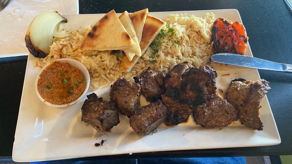 Beef Kabab · Grilled beef filet mignon skewer marinated in special home-made sauce. Served with grilled tomatoes and onions and a bed of vermicelli rice and your choice of hummus, muhammara, baba-ghannouj or Greek salad.