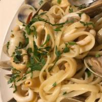 Linguine Di Mare · Grilled scallops & shrimp, sauteed clams & calamari with lemony garlic & white wine butter o...