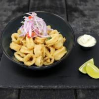 Calamari · Fresh squid marinated and deep fried. Served with yucca and sarza criolla.