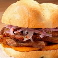 Pan Con Chicharron · 24-hour marinated and fried pork belly topped with fried sweet potato, sarza criolla, and an...