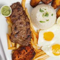 Bistec A Lo Pobre · Tender steak, fried plantains, and fried eggs. Served over French fries and rice.