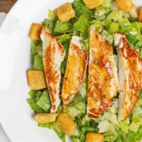 Caesar Salad · Romaine lettuce mixed with parmesan cheese and croutons.