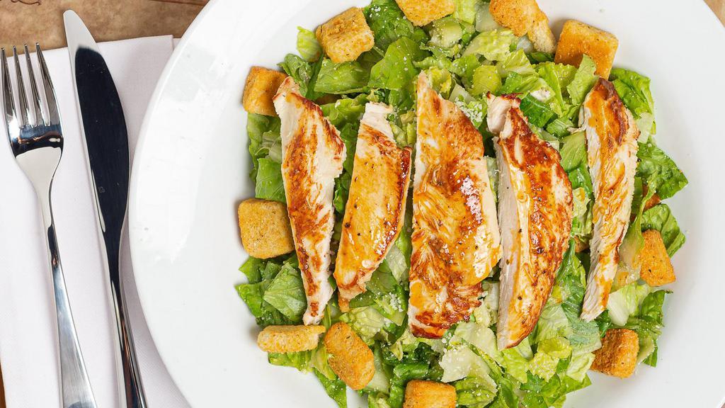 Caesar Salad · Romaine lettuce mixed with parmesan cheese and croutons.