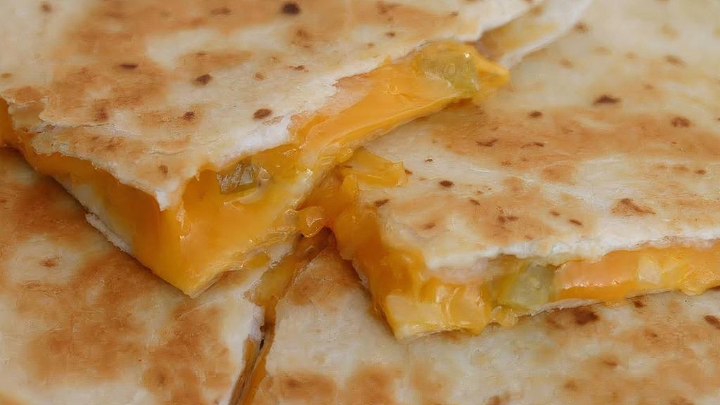 Quesadilla · Side grilled flour tortilla with melted cheese and your choice of meat chicken, beef, chorizo, carnitas or veggie served with lettuce, tomato and sour cream on the side. Steak for additional cost.