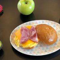 Egg, Ham & Cheese Sandwich · 2 eggs scrambled, ham, melty cheddar cheese on a brioche bun.