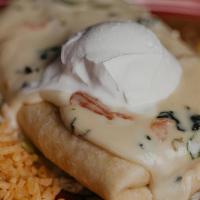 Chimichanga Dinner · Deepfried burrito stuffed with cheese and your favorite protein choice topped with cheese di...