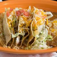 Crispy Taco Dinner  · Three delicious tacos beef or chicken  served with rice & beans.
