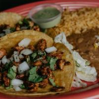 Street Taco Dinner · Three  authentic street tacos served with a side of avocado sauce ,  rice and beans