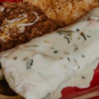 Fajita Burrito · 12” Burrito stuffed with beans, choice of protein, grilled red, green peppers, onions topped...