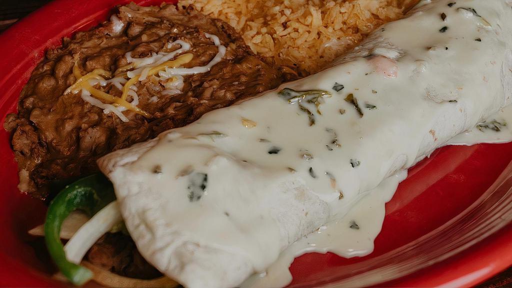 Fajita Burrito · 12” Burrito stuffed with beans, choice of protein, grilled red, green peppers, onions topped with cheese dip, served with rice and beans.