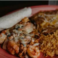 Estilos Favorite · Chicken, steak, shrimp fajita topped with cheese dip , served with tortillas, rice and beans.