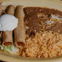 Flautas Dinner · Three fluata stuffed with shredded cheese, choice of protein , topped with sour cream, serve...