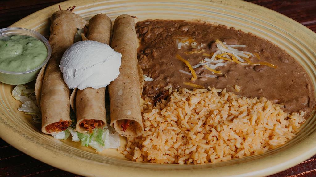 Flautas Dinner · Three fluata stuffed with shredded cheese, choice of protein , topped with sour cream, served with rice and beans.