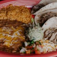 Taco Carnitas Dinner · Three soft flour carnitas tacos topped with shredded cheese, pico, lettuce,  served with ric...