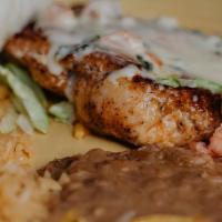 El Patron Chicken · Chicken breast topped with cheese dip served with tortillas, rice and beans