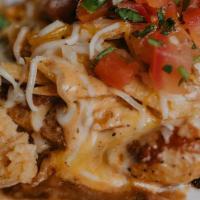 Coyote Lime Chicken · Chicken breast topped with shredded cheese, tortilla strips, chipotle sauce, pico served wit...