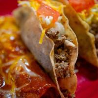 Los Compas · Build your two  choice of tacos topped with lettuce, shredded cheese, tomato, one enchilada ...