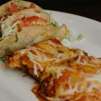 El Jefe · Two  pork or chicken tamales topped with red salsa and
Shredded cheese, with two beef or Chi...