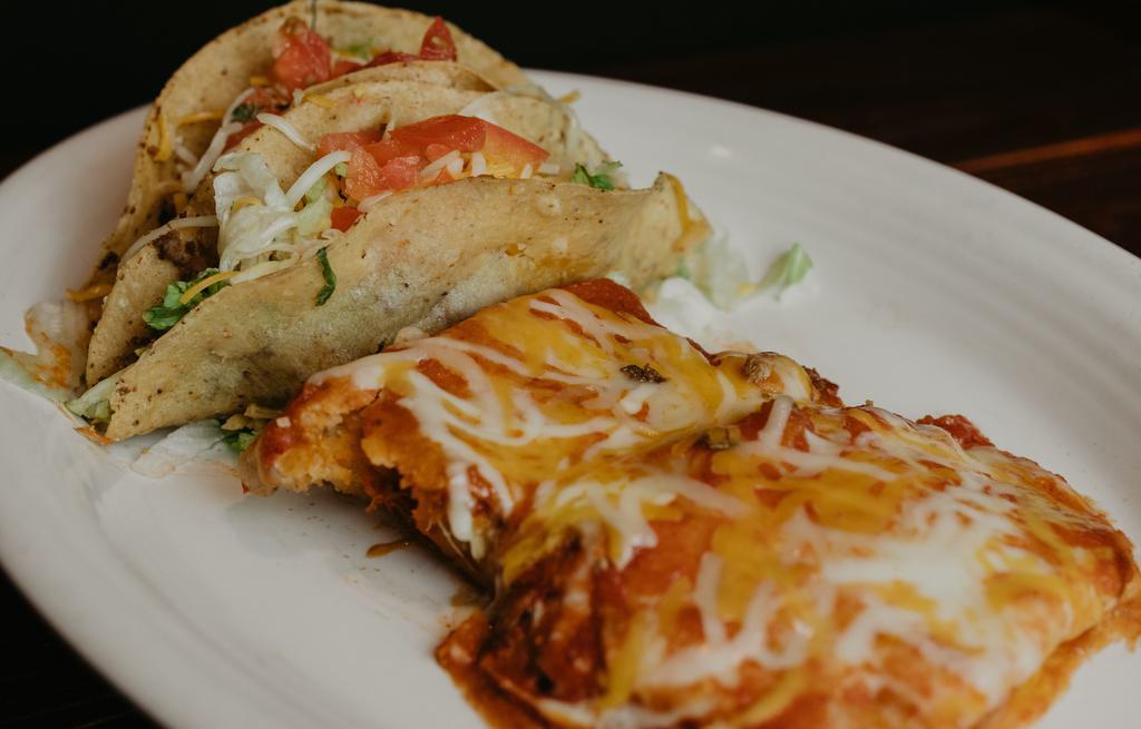 El Jefe · Two  pork or chicken tamales topped with red salsa and
Shredded cheese, with two beef or Chicken crispy tacos
No sides.