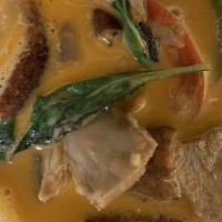 Duck Curry · Boneless roasted duck with tomato, pineapple, bell pepper and sweet basil, simmered in cocon...