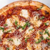 Margherita · Red Pizza, Sliced Mozzarella, Basil, Olive Oil