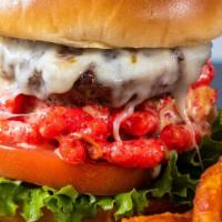 Hot Cheetos · Pepper jack and house cheese sauce, hot cheetos, garlic aioli , lettuce, and tomato.