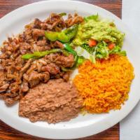 #4. Beef Fajita · Grilled fajita strips mixed w/ bell peppers, onion & tomatoes served w/rice, beans, guacamol...