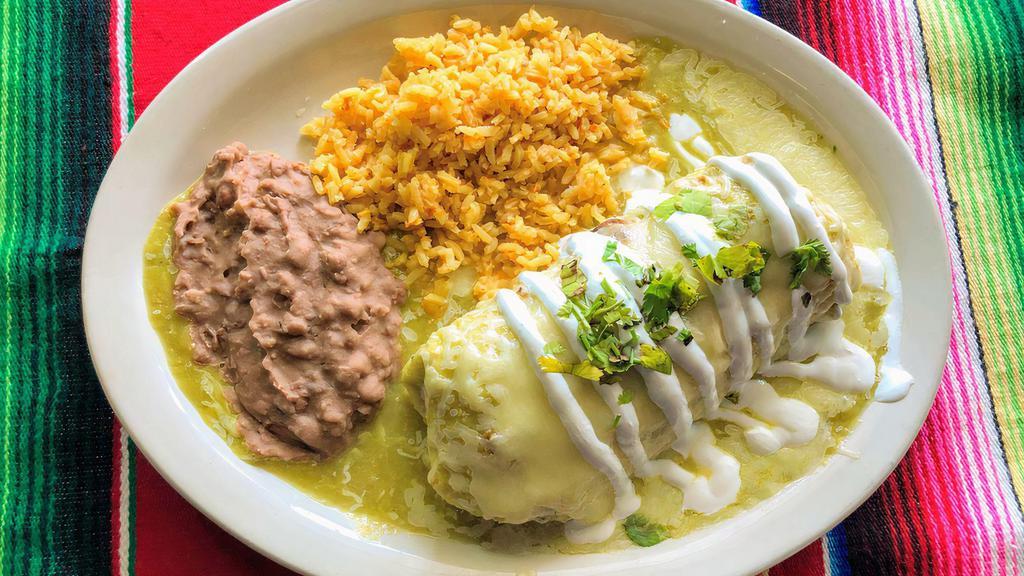 #12.Burrito Mayito Plate · A burrito filled w/ your choice of meat, onions, queso fresco topped w/ our house recipe green sauce, melted monterrey cheese,sour cream & cilantro served w/ rice & beans