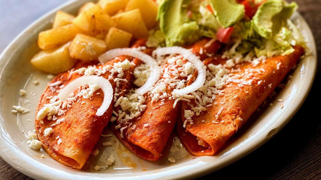 #21 Enchiladas Mexicanas · 3 Red Enchiladas with Queso Fresco & Onions slices accompanied with Potatoes, Avocado and Salad