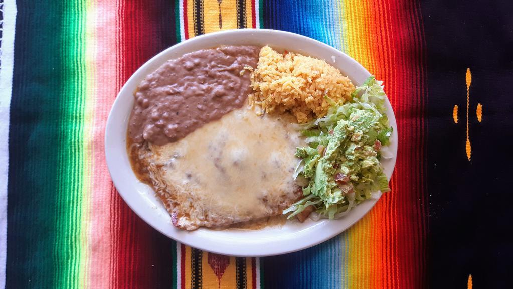 #8 Pechuga Flameada · Chicken breast toped w/ranchero sauce & melted Monterrey cheese served w/rice, beans, guacamole salad & 2 tortillas
